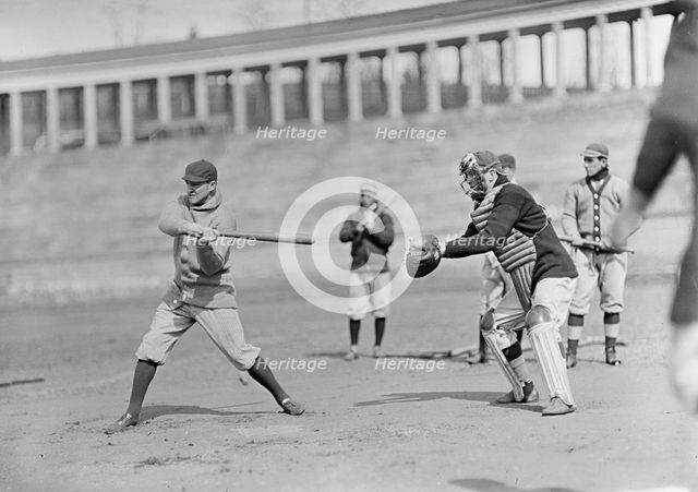 Joe Connolly at Bat, Jack Calvo at Right, Washington Al, at University of Virginia..., ca. 1913. Creator: Harris & Ewing.
