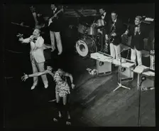 Joe Loss (left) on stage with his orchestra at the Forum Theatre, Hatfield, Hertfordshire, 1986. Creator: Denis Williams