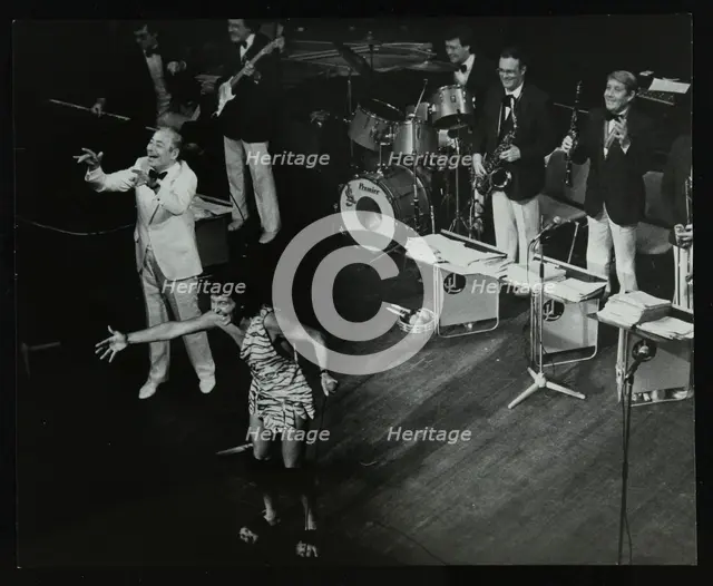 Joe Loss (left) on stage with his orchestra at the Forum Theatre, Hatfield, Hertfordshire, 1986. Creator: Denis Williams.