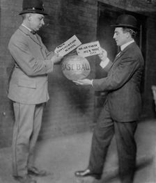Joe Tinker receiving medicine ball sent by Continuation School 1913, 1913. Creator: Bain News Service
