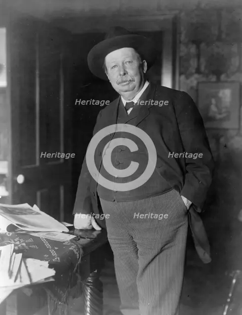 Joel Chandler Harris, three-quarter-length portrait, standing, facing slightly left, c1890 and 1910. Creator: Frances Benjamin Johnston.