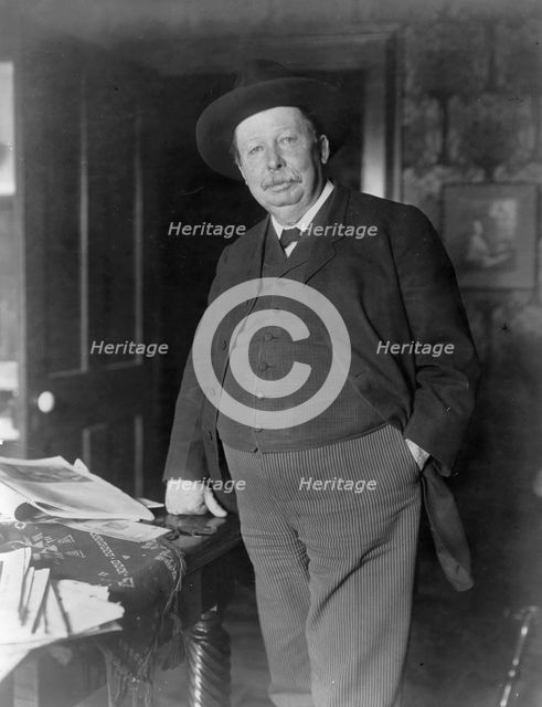 Joel Chandler Harris, three-quarter-length portrait, standing, facing slightly left, c1890 and 1910. Creator: Frances Benjamin Johnston.