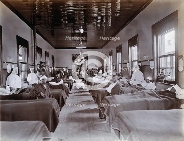 Johannesburg Hospital, South Africa: hospital ward with male patients, many with bandaged...c1905. Creator: Unknown.
