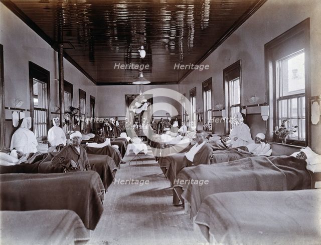 Johannesburg Hospital, South Africa: hospital ward with male patients, many with bandaged...c1905. Creator: Unknown.