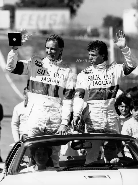 John Watson and Jan Lammers waving at the crowds at Jarama, Spain, 1987. Artist: Unknown