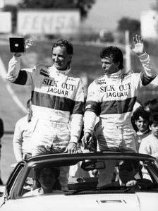John Watson and Jan Lammers waving at the crowds at Jarama, Spain, 1987