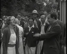John Bonyton Priestley Tosses a Coin With Gladys Cooper, 1920s. Creator: British Pathe Ltd