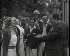 John Bonyton Priestley Tosses a Coin With Gladys Cooper, 1920s. Creator: British Pathe Ltd