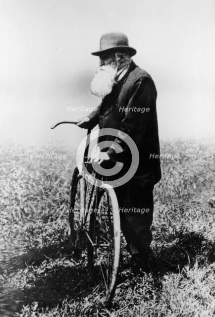 John Boyd Dunlop with bicycle, July 1918. Artist: Unknown