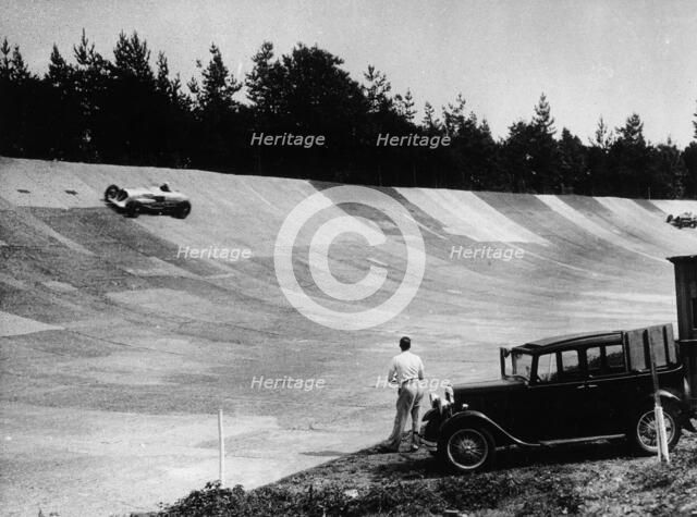 John Cobb's Napier Railton on the banking, Brooklands, Surrey, c1933-c1935. Artist: Unknown