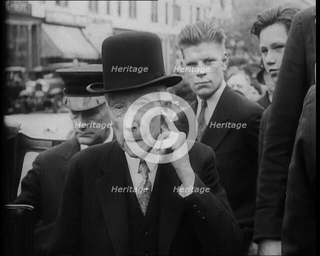 John D. Rockefeller Standing with Other People Next to a Car, 1933. Creator: British Pathe Ltd.