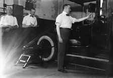 John Drennen inspecting meter, 1913. Creator: Bain News Service