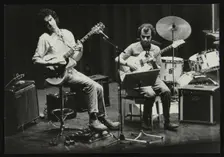 John Etheridge and Gary Boyle playing at Campus West Welwyn Garden City, Hertfordshire, 1984. Creator: Denis Williams