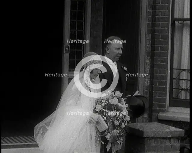 John Henry Thomas and His Daughter Emerging from a Building, 1924. Creator: British Pathe Ltd.
