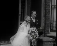 John Henry Thomas and His Daughter Emerging from a Building, 1924. Creator: British Pathe Ltd