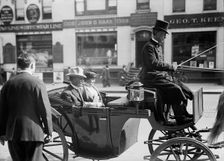 John Lind, Governor of Minnesota, in Carriage with Mrs. Lind, 1914. Creator: Harris & Ewing