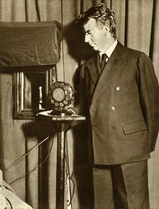 John Logie Baird watching the first play to be televised, 14 July 1930, (1935). Creator: Unknown