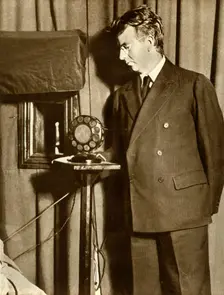 John Logie Baird watching the first play to be televised, 14 July 1930, (1935). Creator: Unknown