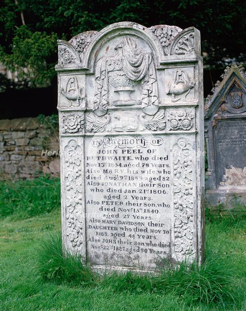 John Peel's gravestone, St Kentigern's parish churchyard, Caldbeck, Cumbria.  Creator: Peter Thompson.