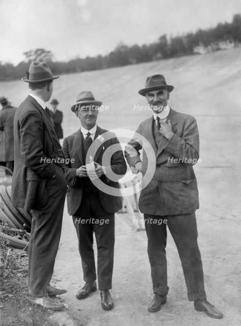 John Portwine and Selwyn Edge of AC Cars at Brooklands motor racing circuit, Surrey, c1921. Artist: Bill Brunell.