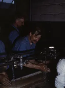 John Sabados washing up after a day's work..., Proviso yard of C & NW RR, Chicago, Ill., 1943. Creator: Jack Delano