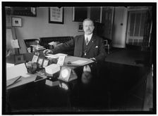 John Skelton Williams at desk, between 1913 and 1918. Creator: Harris & Ewing