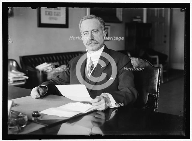 John Skelton Williams at Desk, between 1913 and 1918. Creator: Harris & Ewing.