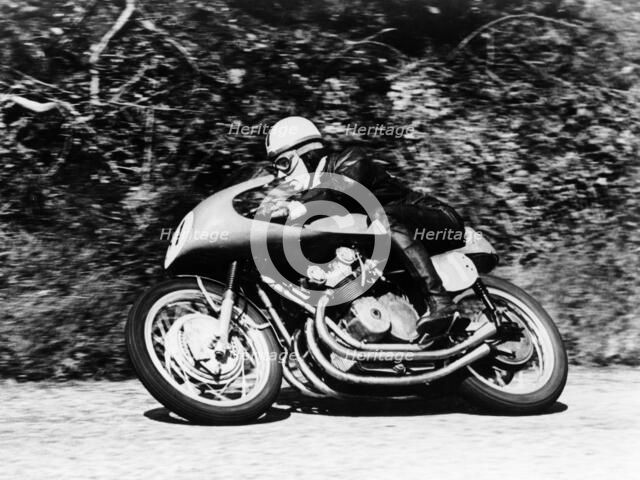 John Surtees on an MV Agusta, Waterworks Corner, Isle of Man Senior TT, 1956. Artist: Unknown