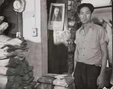 Johnnie Lew, owner of the laundry under the apartment of Mrs. Ella..., Washington, D.C., 1942. Creator: Gordon Parks