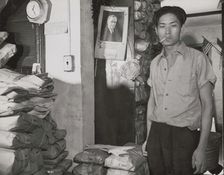 Johnnie Lew, owner of the laundry under the apartment of Mrs. Ella..., Washington, D.C., 1942. Creator: Gordon Parks