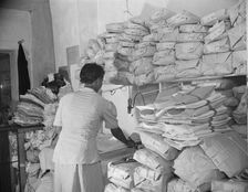 Johnnie Lew's Chinese laundry on Monday morning, Washington, D.C., 1942. Creator: Gordon Parks