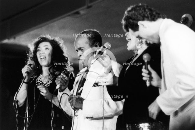Jon Hendricks and three unidentified singers, c1998. Creator: Brian Foskett.
