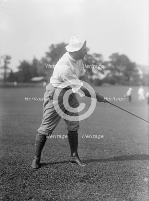 Joseph Edward Davies, Chairman, Federal Trade Commission. Playing Golf, 1917. Creator: Harris & Ewing.