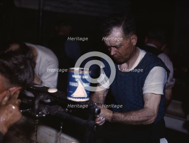 Joseph Klesken washing up after a day's work...Proviso yards of the C & NW RR, Chicago, Ill., 1943. Creator: Jack Delano.