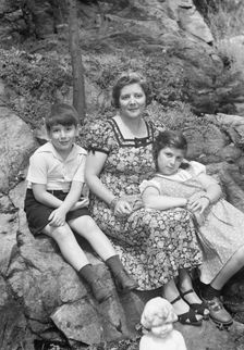 Javits, Benjamin, Mrs., and children, seated oudoors, ca. 1935. Creator: Arnold Genthe