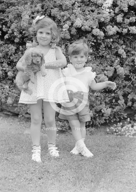 Javits, Benjamin, children of, with dog, standing outdoors, 1933 July. Creator: Arnold Genthe.