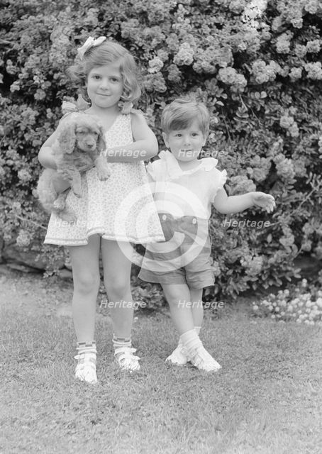Javits, Benjamin, children of, with dog, standing outdoors, 1933 July. Creator: Arnold Genthe.