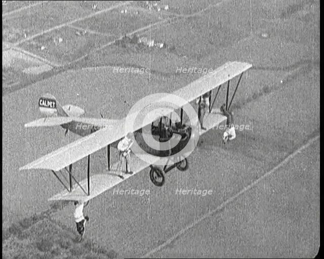Jazz Musicians Playing from the Wing of a Biplane in the Air, 1921. Creator: British Pathe Ltd.
