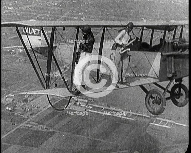 Jazz Musicians Playing from the Wing of a Biplane in the Air, 1921. Creator: British Pathe Ltd.