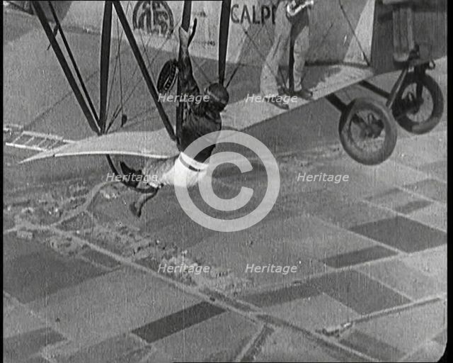 Jazz Musicians Playing from the Wing of a Biplane in the Air, 1921. Creator: British Pathe Ltd.