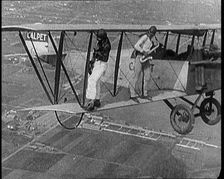 Jazz Musicians Playing from the Wing of a Biplane in the Air, 1921. Creator: British Pathe Ltd