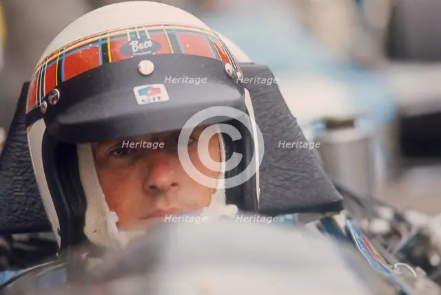 Jackie Stewart at the wheel of a racing car. Artist: Unknown