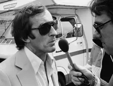 Jackie Stewart being interviewed, 1980