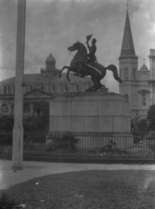 Jackson monument in Jackson Square with the Cabildo and St. Louis Cathedral, New Orleans, c1920-26. Creator: Arnold Genthe