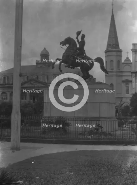Jackson monument in Jackson Square with the Cabildo and St. Louis Cathedral, New Orleans, c1920-26. Creator: Arnold Genthe.