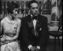 Jack Buchanan and June Knight Sitting on a Bench Together. Buchanan Looking Uncomfortable...,1920s Creator: British Pathe Ltd