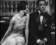 Jack Buchanan and June Knight Sitting on a Bench Together. Buchanan Looking Uncomfortable...,1920s Creator: British Pathe Ltd