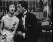 Jack Buchanan and June Knight Sitting on a Bench Together. Buchanan Looking Uncomfortable...,1920s Creator: British Pathe Ltd
