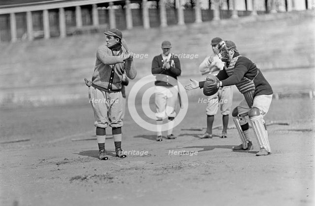 Jack Calvo at Bat, Vic Bickers (Maybe) in Dark Sweater Holding Bat, Al Scheer Left of..., ca. 1913. Creator: Harris & Ewing.