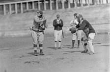 Jack Calvo at Bat, Vic Bickers (Maybe) in Dark Sweater Holding Bat, Al Scheer Left of..., ca. 1913. Creator: Harris & Ewing